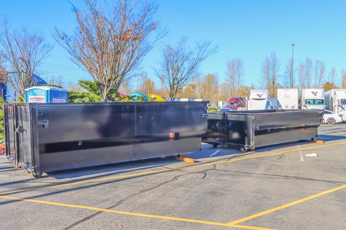 Professional dumpster rental service with roll-off container on residential driveway in North Augusta